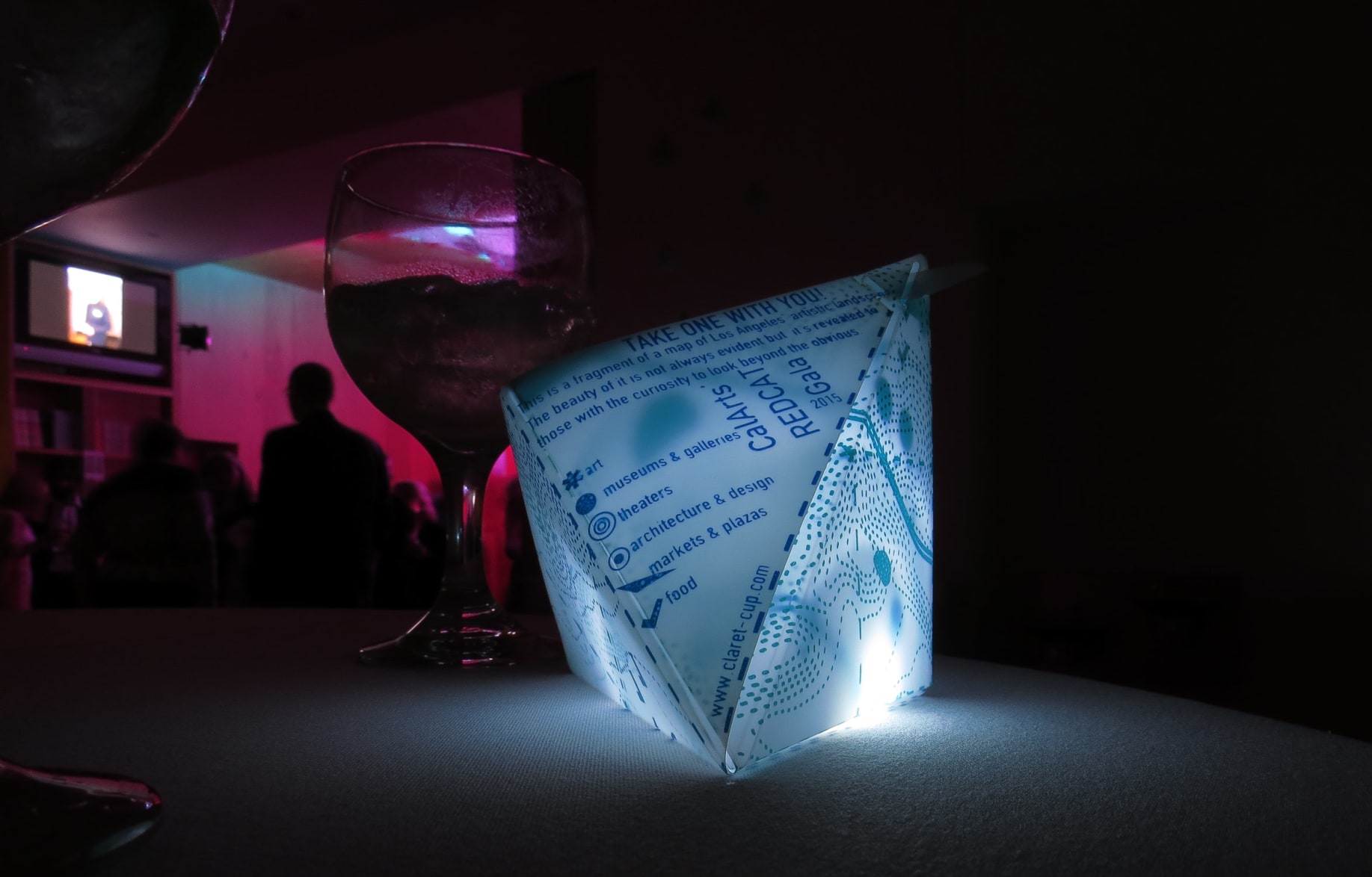 Glowing paper art on a dark table