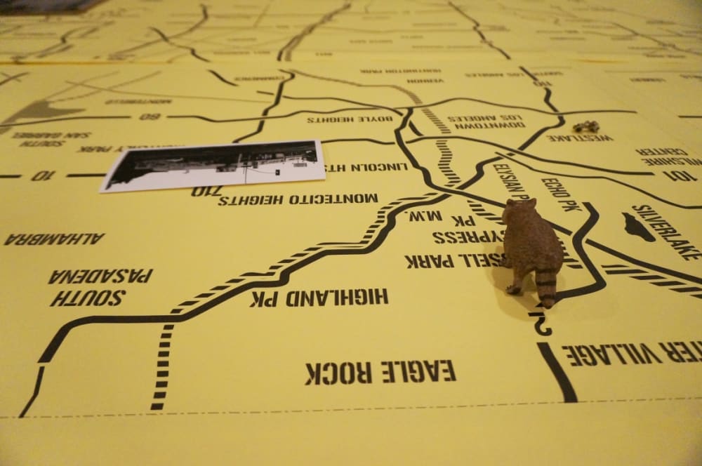 Guests seated around a giant map on a table detail